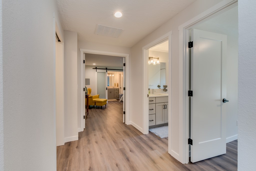 master suite with French doors and sliding barn doors